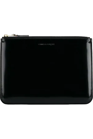 Comme des Garçons Logo-debossed leather clutch bag