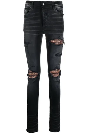 AMIRI Ripped skinny-fit jeans