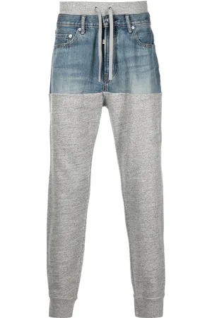 ROMEO HUNTE Denim-panelled jersey trousers