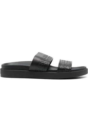 Calvin Klein Embossed-logo leather slides