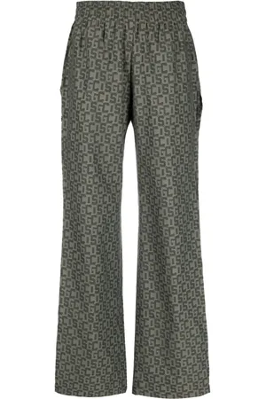 GCDS Open-leg monogram trousers