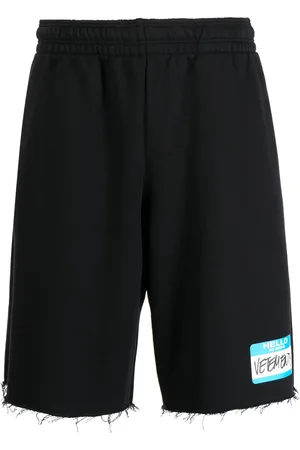 Vetements Logo-print frayed track shorts