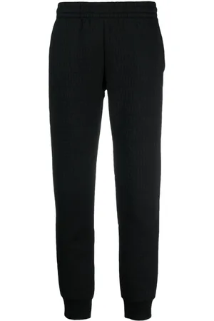 Moschino Flocked-logo elasticated-waist track pants