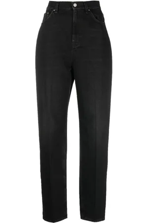 Totême Faded-effect tapered-leg jeans