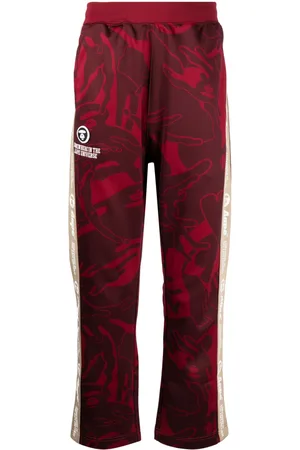 A Bathing Ape Graphic-print logo-patch trousers
