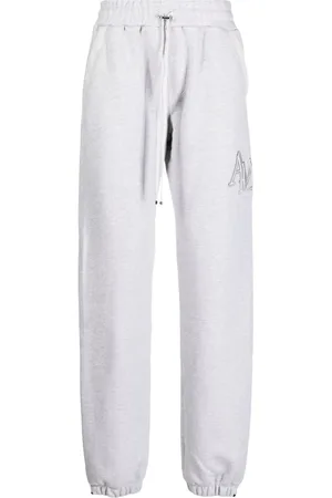 AMIRI Staggered logo-embroidered track pants