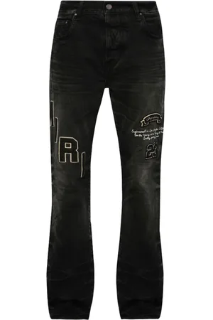 AMIRI Logo-patch distressed jeans