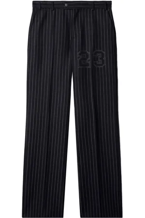 OFF-WHITE Number-print pinstriped slim-cut trousers