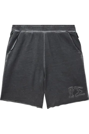 Izzue Distressed cotton track shorts