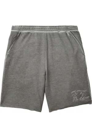 Izzue Distressed cotton track shorts