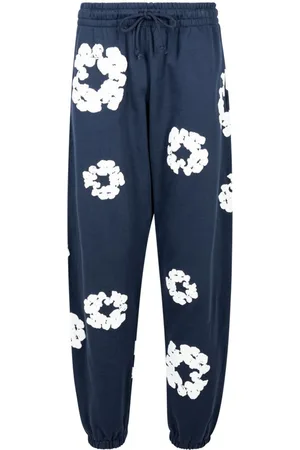 DENIM TEARS Cotton Wreath-print track pants