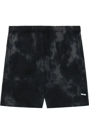 Izzue Logo-appliqué tie-dye shorts