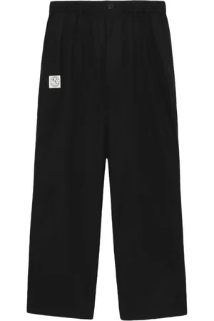 Izzue Logo-appliqué loose-fit trousers