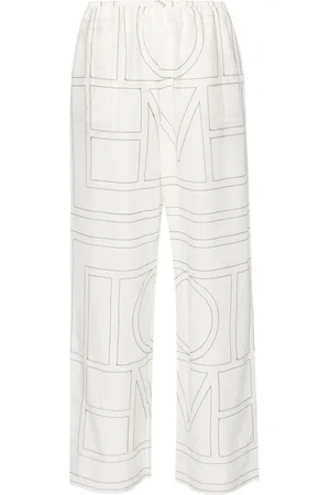 Totême Embroidered-monogram trousers