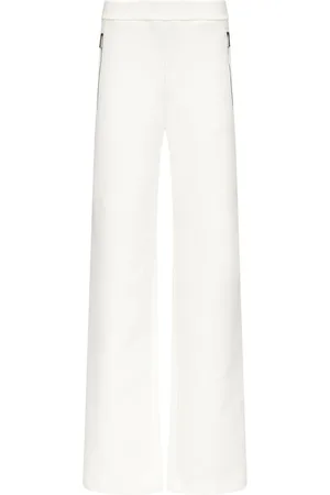 AREA Embossed handprint track pants