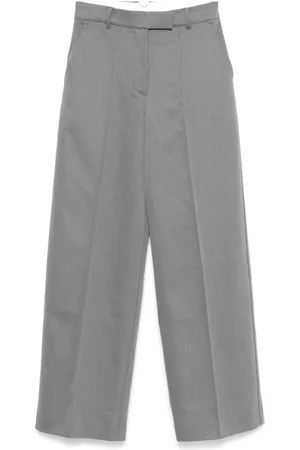 REMAIN Twill-weave striped trousers