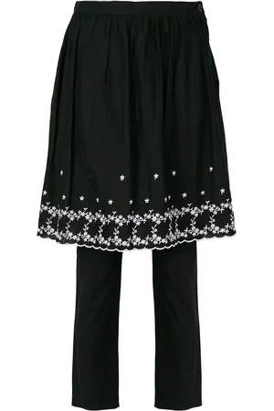 Comme des Garçons Embroidered skirt over trousers
