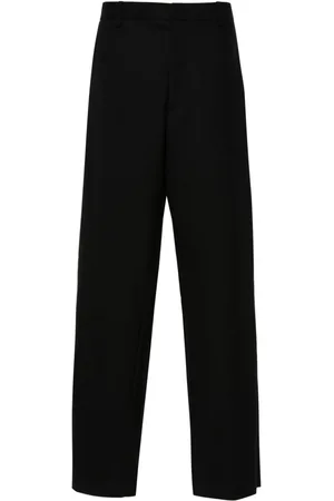 Moschino Pressed-crease trousers