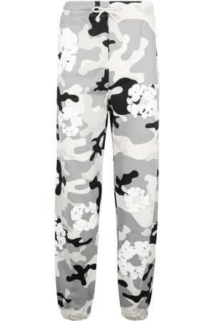 DENIM TEARS Camouflage-print trousers