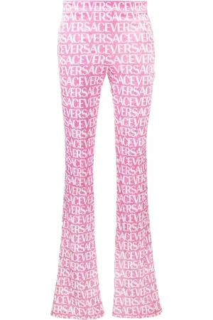 VERSACE Logo-print flared trousers