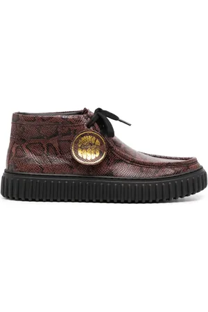 MARTINE ROSE Snake-print leather boots