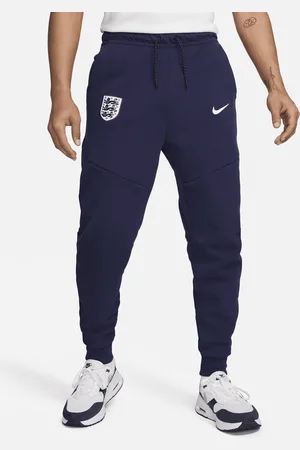 Nike Pánské fotbalové běžecké kalhoty Anglie Tech Fleece