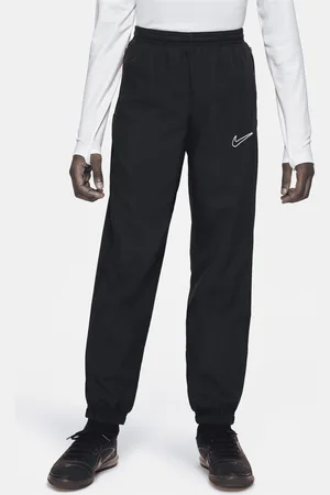 Nike Tkané fotbalové kalhoty Dri-FIT Academy pro větší děti (skladem)