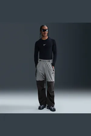 Nike Pánské volné tkané kalhoty Tech