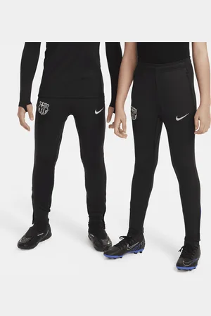 Nike Pleteninové fotbalové kalhoty Dri-FIT FC Barcelona Strike pro větší děti