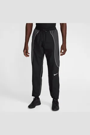 Nike Pánské vodoodpudivé fotbalové kalhoty Strike+