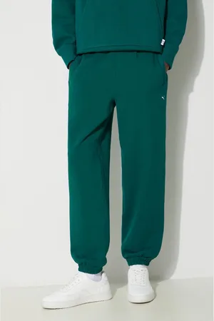 PUMA Bavlněné tepláky MMQ Sweatpants zelená barva