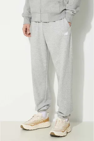 New Balance Tepláky Sport Essentials barva