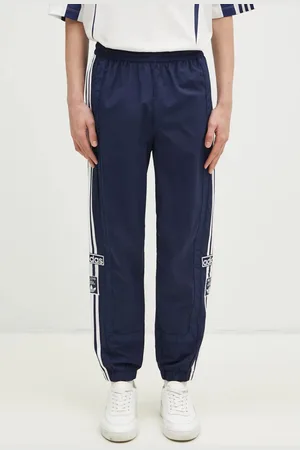 adidas Tepláky Adibreak tmavomodrá barva