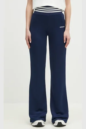 adidas Tepláky FLARED PANTS tmavomodrá barva