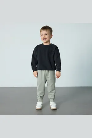 Reserved Bavlněné kalhoty joggers s kapsami