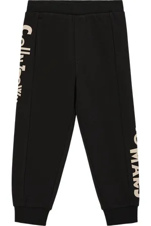 QS by s.Oliver Loose: joggingové kalhoty s natištěným nápisem po straně, Unisex