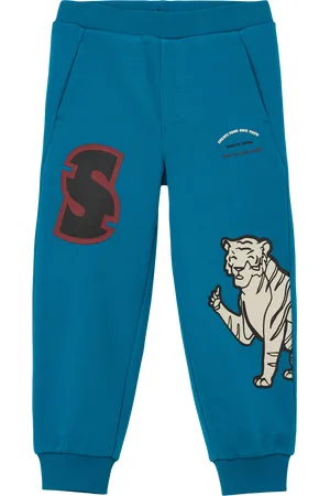 QS by s.Oliver Regular: joggingové kalhoty s pogumovaným potiskem, Unisex