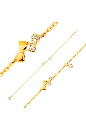 Šperky Eshop Náramek ve žlutém 14K zlatě - dvě blýskavé mašličky a čirý zirkonek, řetízek