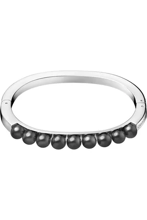 Calvin Klein Pevný ocelový náramek s černými perličkami Circling KJAKMD04010 5,4 x 4,3 cm - XS