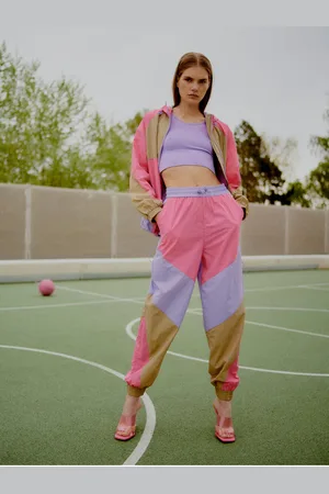 TheJoggConcept Fialovo-růžové dámské šusťákové kalhoty