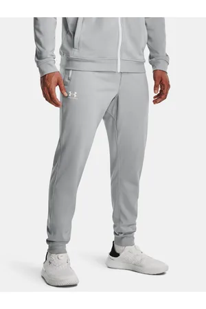 Under Armour Šedé sportovní tepláky SPORTSTYLE TRICOT JOGGER